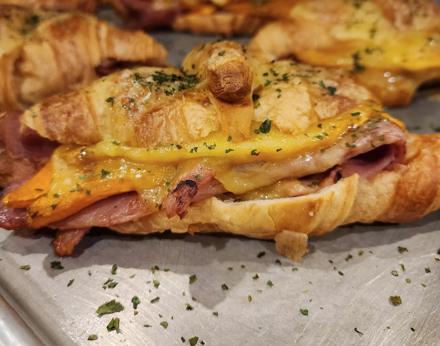 Golden ham and cheese breakfast croissants at Bare Beanz Cafe