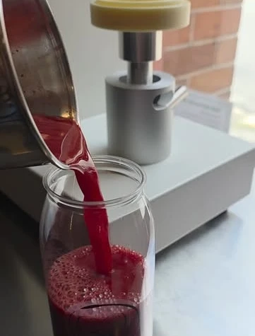 A fresh drink being poured at Bare Beanz